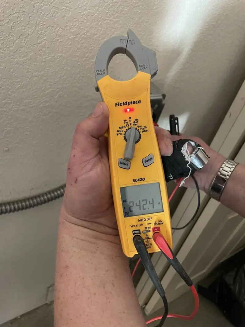 Voltage testing with clamp meter during Generator Installation in Delhi